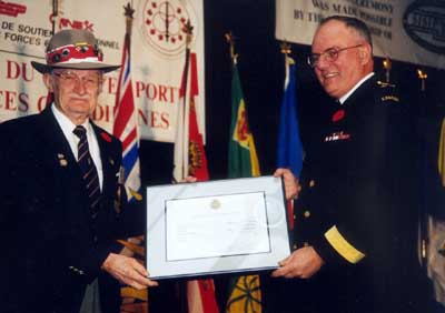 Oct. 28th, 2000 Ralph B. Cathline being inducted into the  Canadian Forces Sports Honour Roll by Vice Admiral Gary Garnet - Vice Chief of Defence Staff