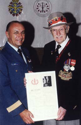 General Henault viewing plaque of Acheivment in Rifle Shooting with “Hall of Fame” Inductee “The Steady Sergeant"